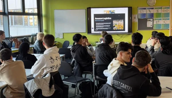 Students in a classroom looking at a presentation